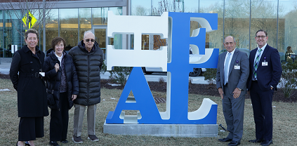 Kara Bennorth, Executive Vice President, Development, WMCHealth; Shirley Singer; Sid Singer; Michael Israel, President and CEO, WMCHealth; Josh Ratner, Executive Vice President, Chief Strategy Officer, WMCHealth pose with the HEALTH sculpture